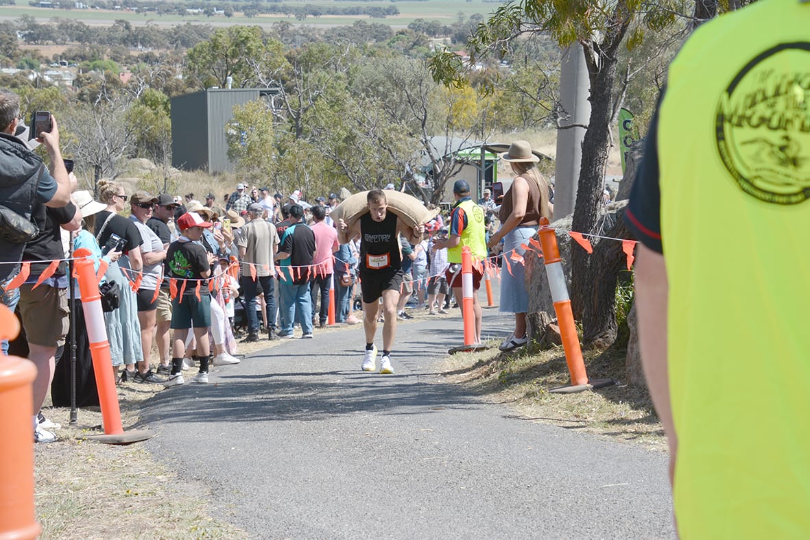 King of the Mountain, Tom Rodgers’s face shows the strain he was under as he neared the finish line, carrying a whopping 60kg of wheat over his shoulders, in a magnificent display of strength and endurance.