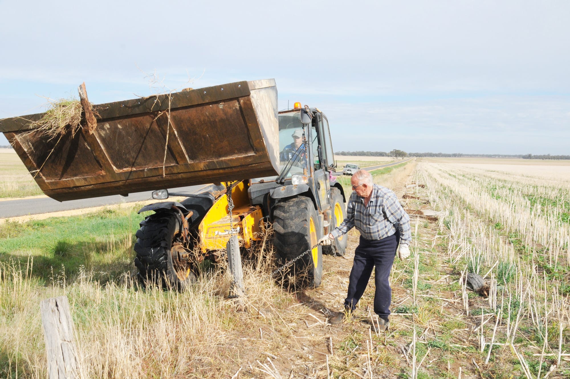 Teamwork: One of the most critical ingredients in any successful football team is teamwork. And in this day and age, the co-operative efforts of young and old alike is ensuring that the Donald Football Club remains viable, both on and off the field. Pictured during a recent two-person working bee, veteran club member, Bill Anderson, teamed up with 14-year-old Will Burke, to remove fence posts for a district farmer. The posts will later be cut up for firewood, another of the club’s activities to assist its supporters.