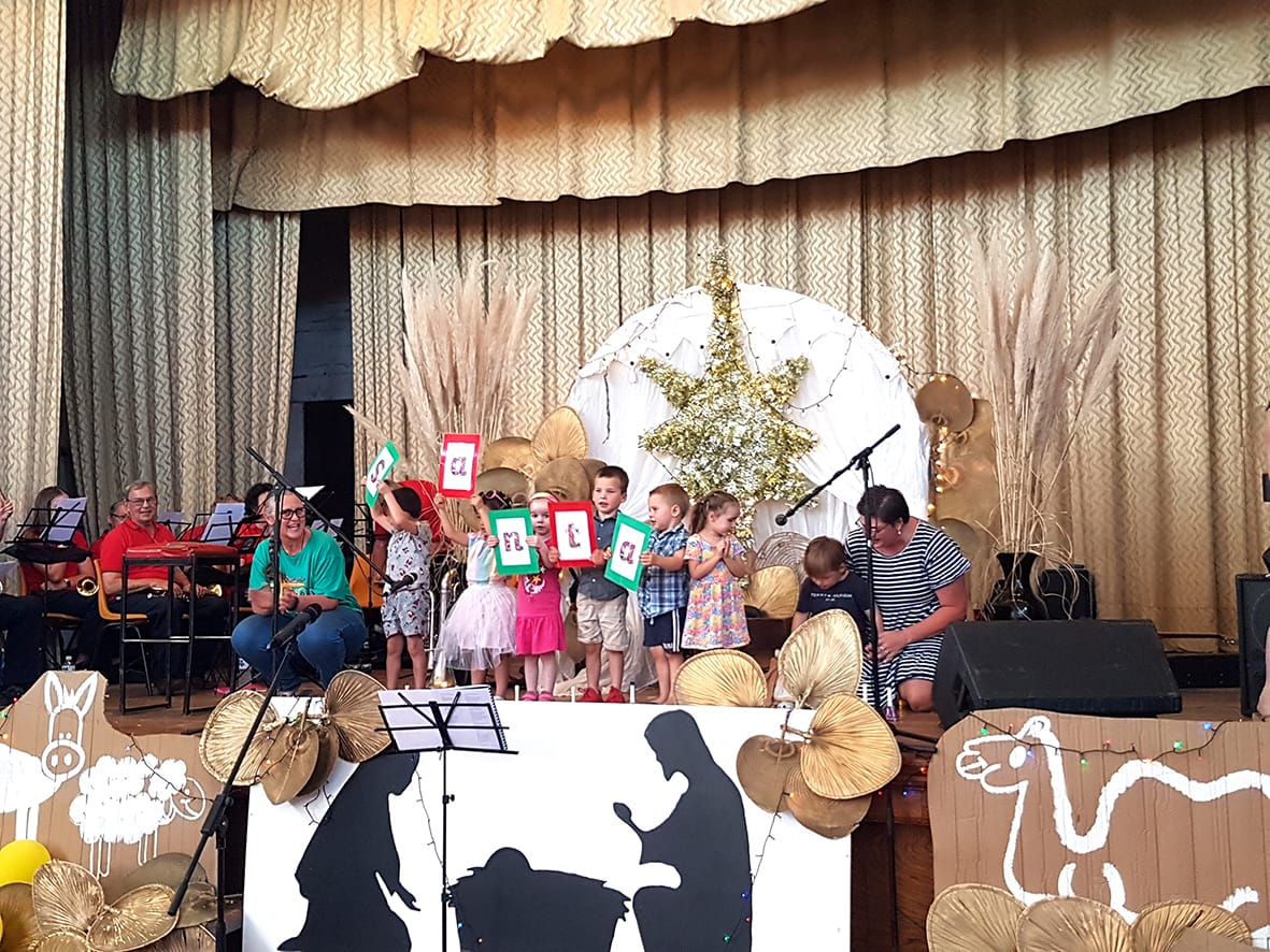 “Cool Carols Beat the Heat”