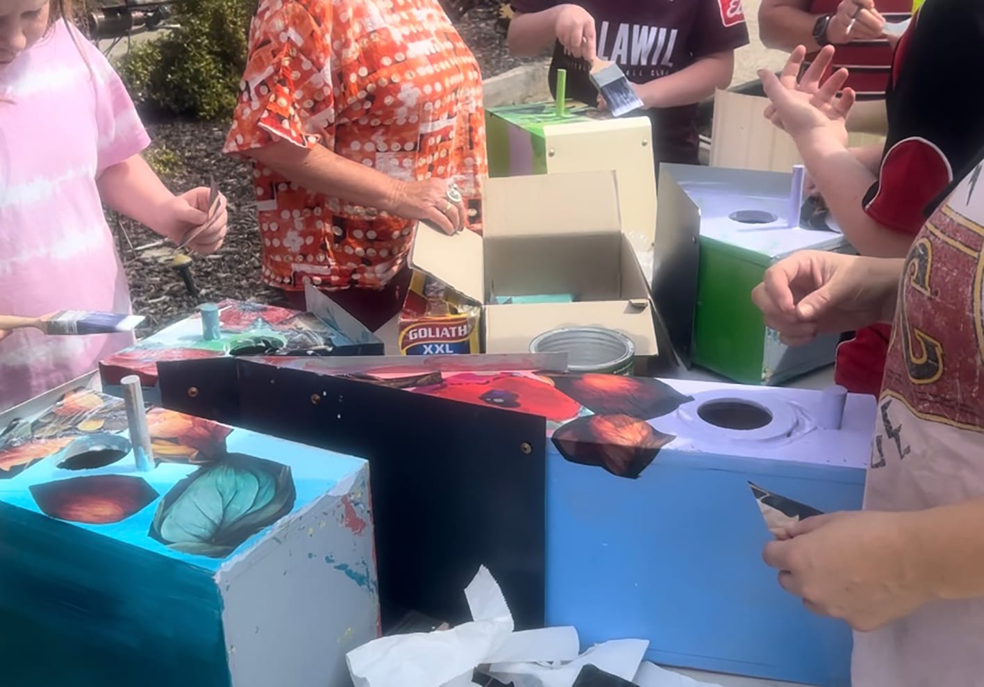 Many hands at work at Nullawil learning decoupage and decorating birdboxes.