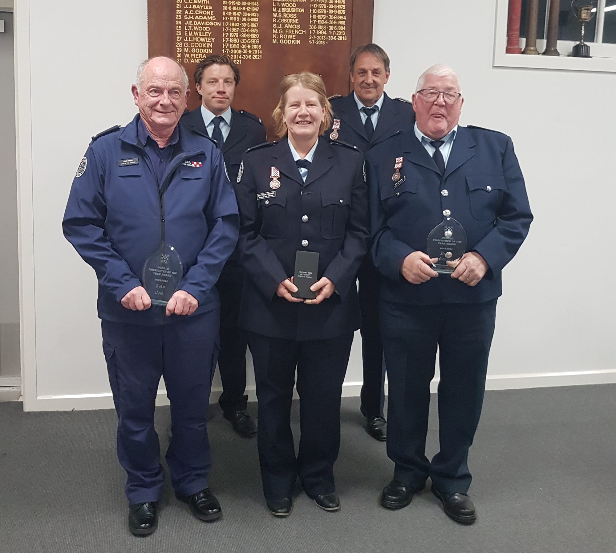 Award winners front row, left to right, John Cook, Belinda Murray and Brian Williams (absent Callum McLachlan). Back row, First Lieutenant Broderick Harrison and Captain Dale Anderson.
