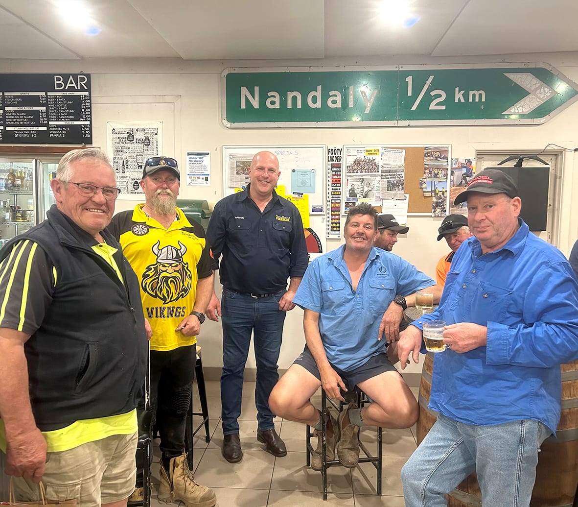 At the Nandaly Pub, Warren Davies opens up about his personal journey, connecting with the community over shared stories. Left to right: Terrence Kiley, Mark Ruddick, Warren Davies, Chris Martin, Matt Brady (partially hidden) Chris Monaghan (partially hidden) and Neil Mott.