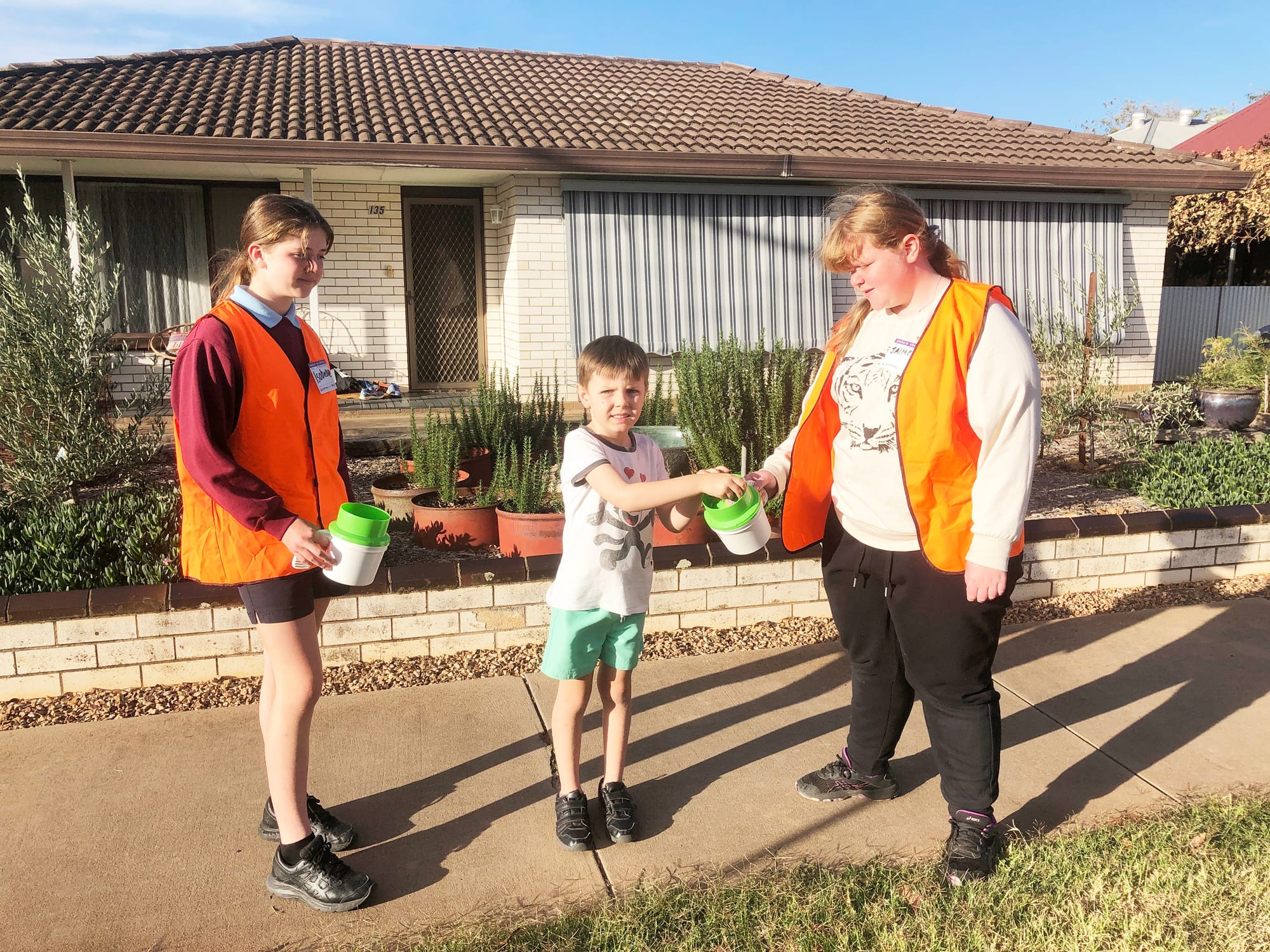 Volunteer collectors Isobelle Rowe (left) and Jaimie Price were among the collectors supporting the Donald Fire Brigade’s annual Good Friday Appeal door knock collection last Tuesday, accepting a donation from five-year-old Abe Beavis.