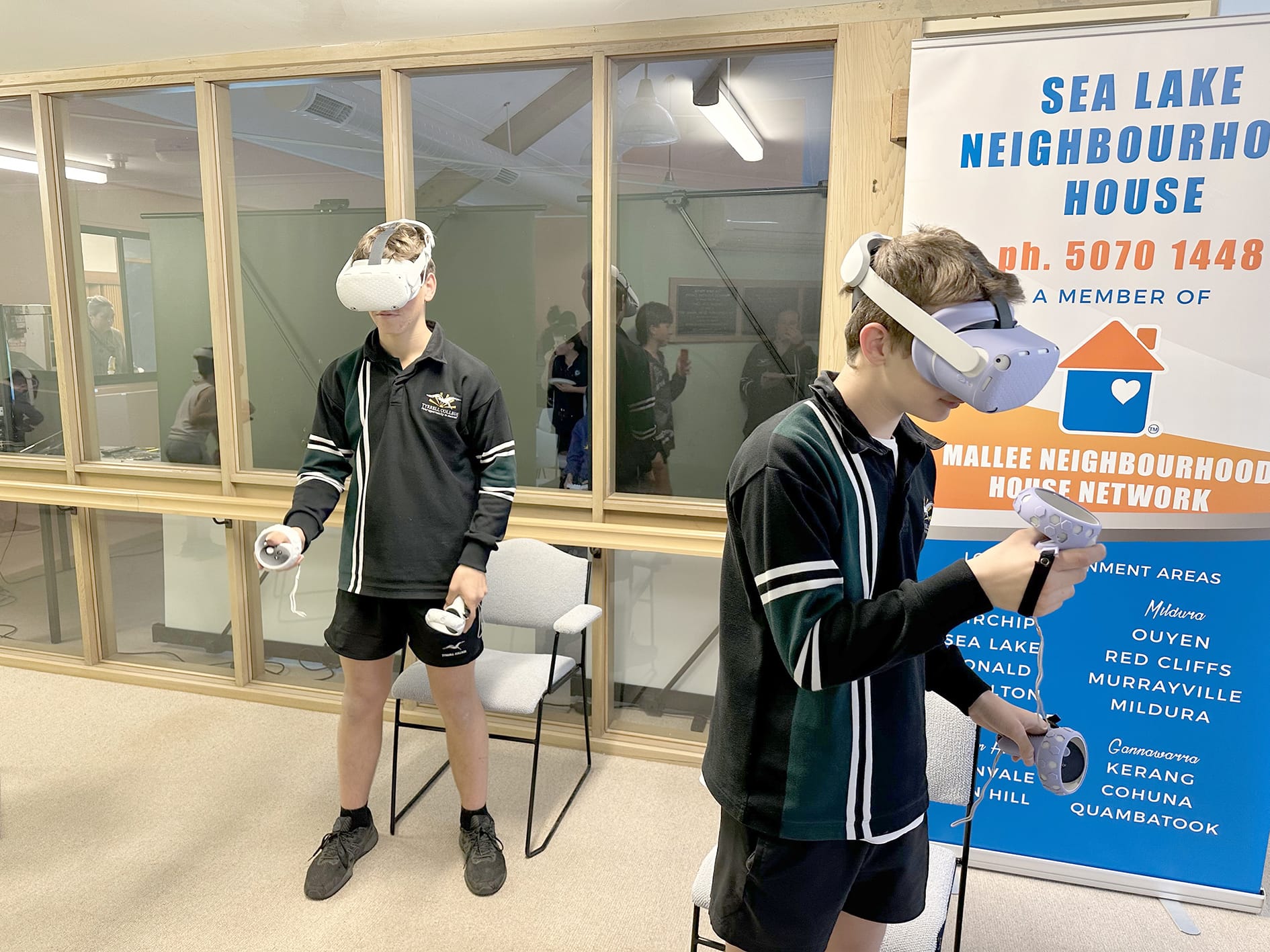 Left to right: Nate McClelland and Cooper Kelly immersed in the virtual world.