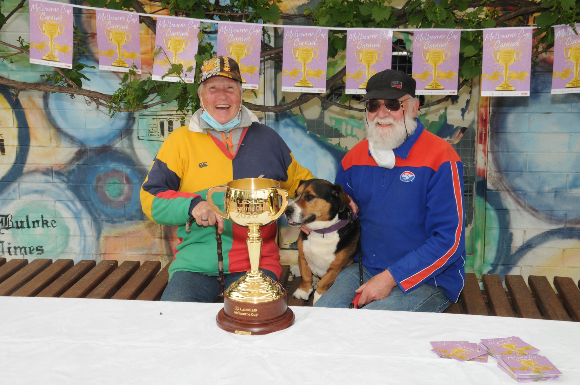 Marion and Brian Bayles, and their faithful canine friend, Boots, of Donald, have their photograph taken with the Melbourne Cup.