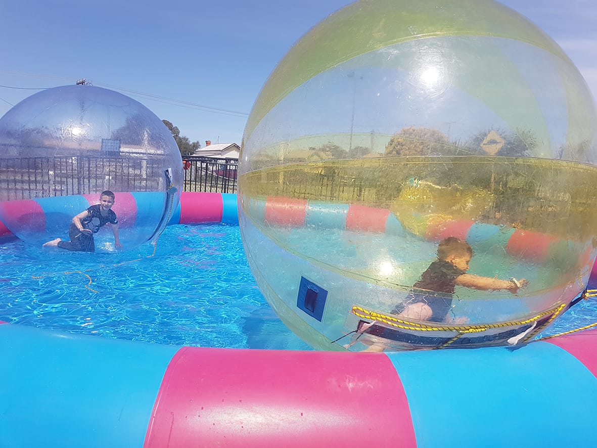 Kids seemed to have a great time in the “walk on water” balls at sideshow alley.