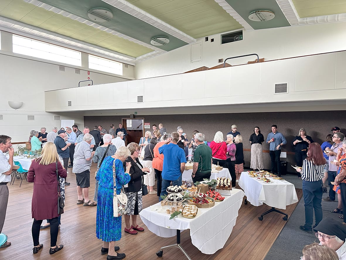 Guests gathered to enjoy a light buffet meal.