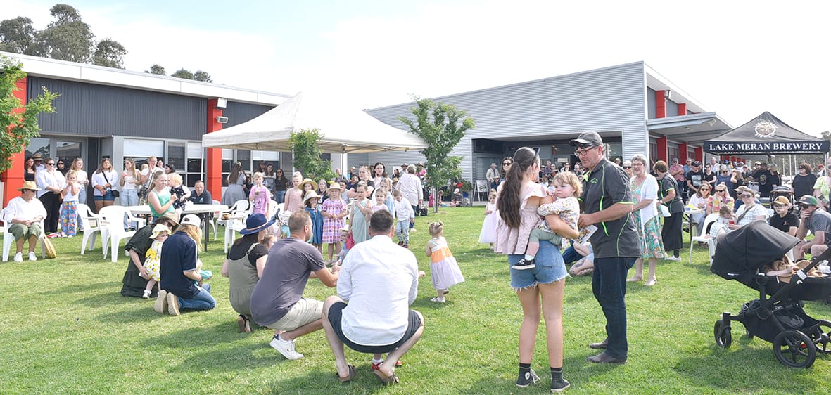 A big crowd gathered on the grass concourse as the Showgirl judging and evening music began.