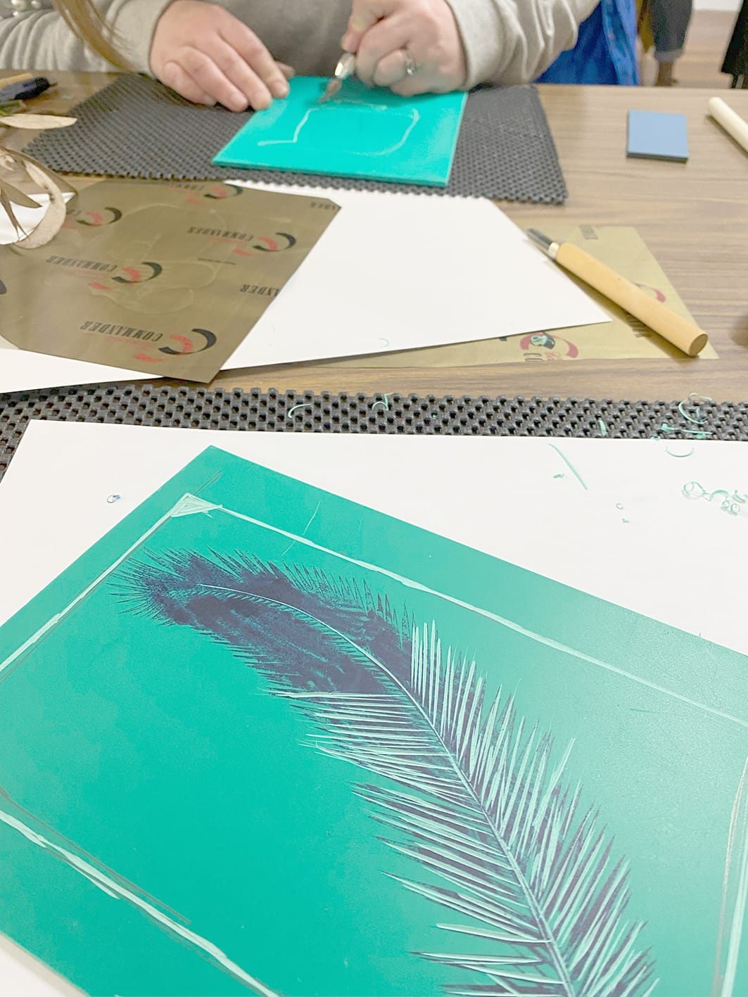 A feather cut into lino.