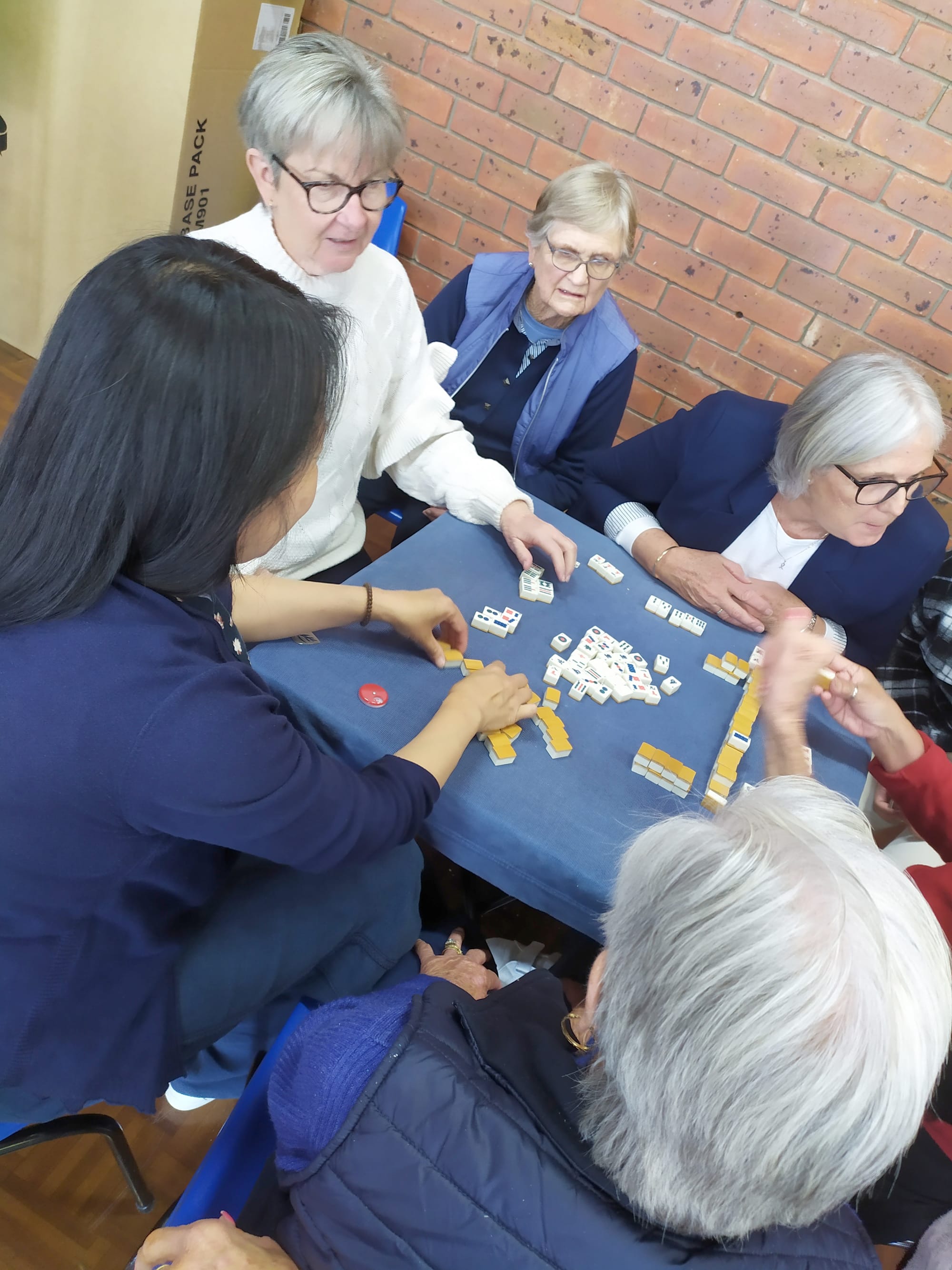 Mahjong Table, clockwise, Ting Warren, Leonie Harvey, Margaret Hogan, Heather Flood, both of Fanny Cinaglia’s hands, Joyce Hollis..... Heather seems to be making innocent if not urgent inquiry of Fanny “was that move legal?” while Leonie’s raised eyebrows seem to indicate “I hope so” Margaret looks about as confused as I was. Joyce unusually passive.