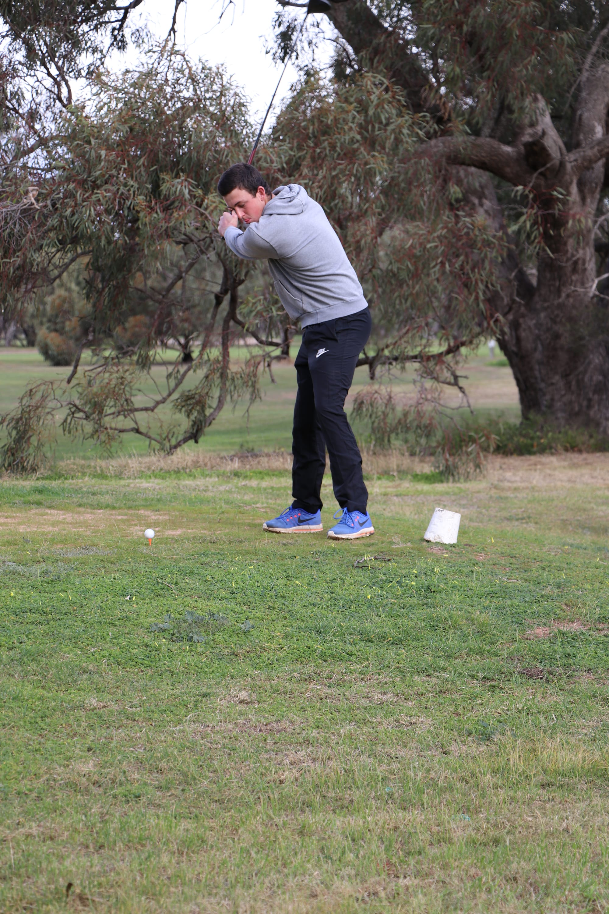 Bailey Baxter winds up to drive off the tee.