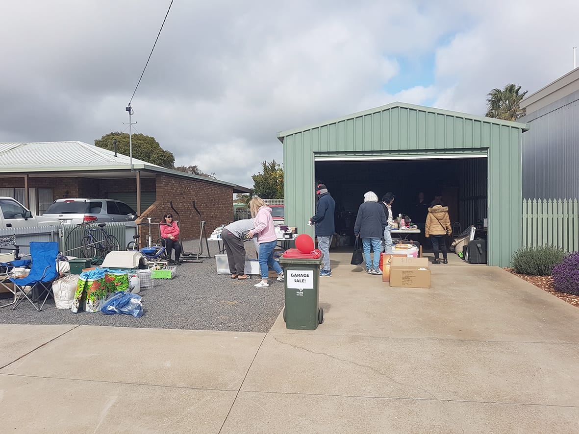 Locations of garage sales were indicated by balloons out the front of the properties involved; this one on Houston Street was selling a mix of items from exercise equipment to garden supplies.