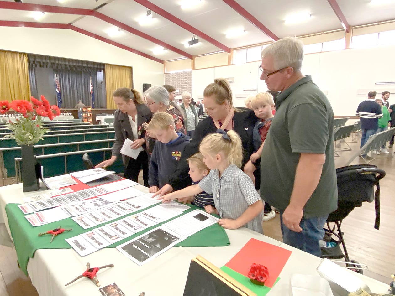 Pictured looking through the oral history display are (left to right) Tara Lowe, Leonie McGillivray and the Smyth family, Archie, Harry, Sophie and Freddie with parents Rachael and Tim.