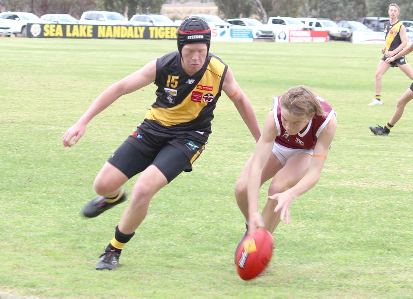 Under-17s. Tigers’ Hamish Pickering (15) puts pressure on Nullawil’s Darcy Coles (12).