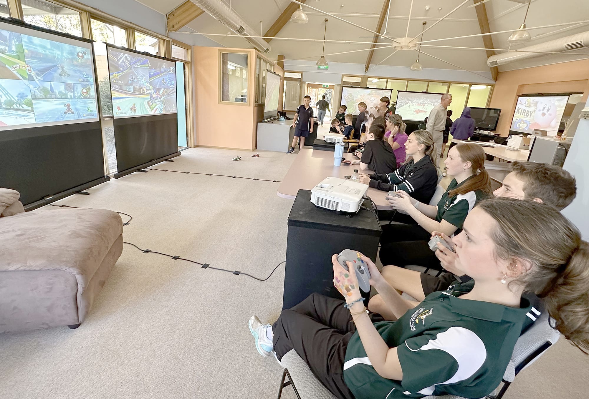 Sea Lake year nine Tyrrell College students gather for some chill time at the Sea Lake Neighbourhood House in a modern twist on the old-school pinball parlour – gaming, food, and milkshakes after school. Just like back in the day, these moments are all about building community connections in a space where everyone belongs. In foreground (from front): Darcey Hodgson, Cooper Kelly, Sienna Allan and Zaida Tait.