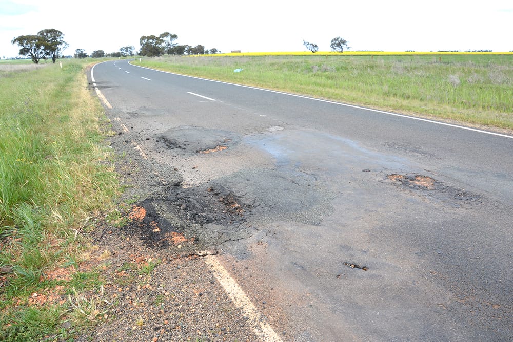 A Year After Statewide Floods . . . Roads Still in Ruins post image